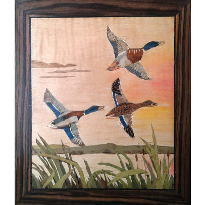 marquetry picture of ducks in flight