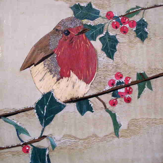marquetry picture of a robin on a holly twig